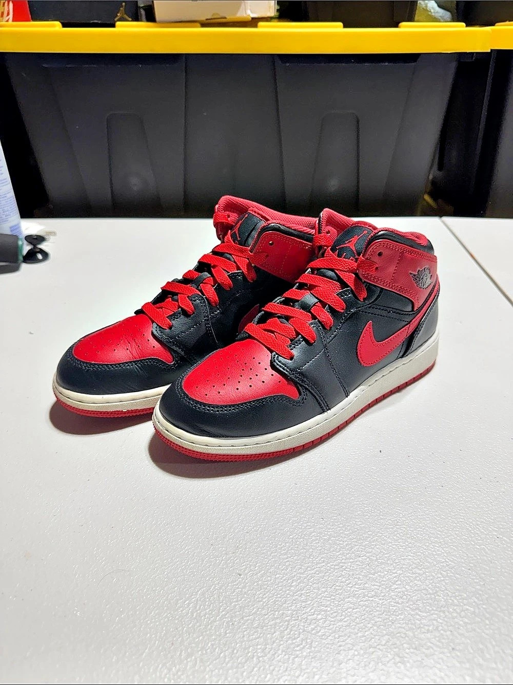 Nike Air Jordan 1 Mid High-Top Sneakers in Red & Black